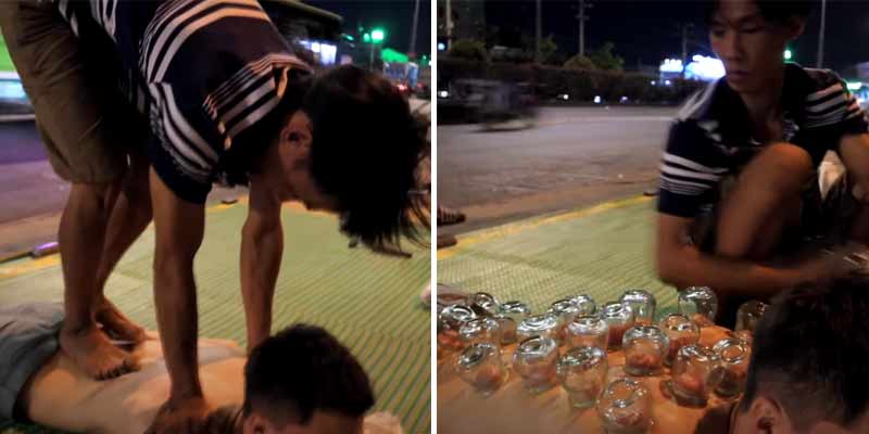 Un turista recibe un masaje en Vietnam en el arcén de una transitada carretera por un par de dólares