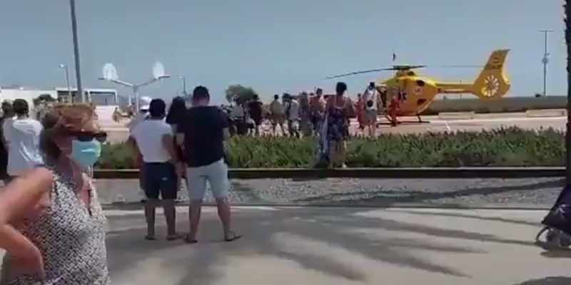 Liada con los miembros de cierta etnia cuando un helicóptero aterriza en el paseo marítimo para salvar a un ahogado