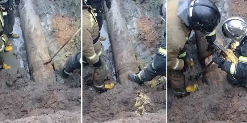 Bomberos rusos tienen que sacar a un hombre que se quedó atrapado en una tubería del alcantarillado
