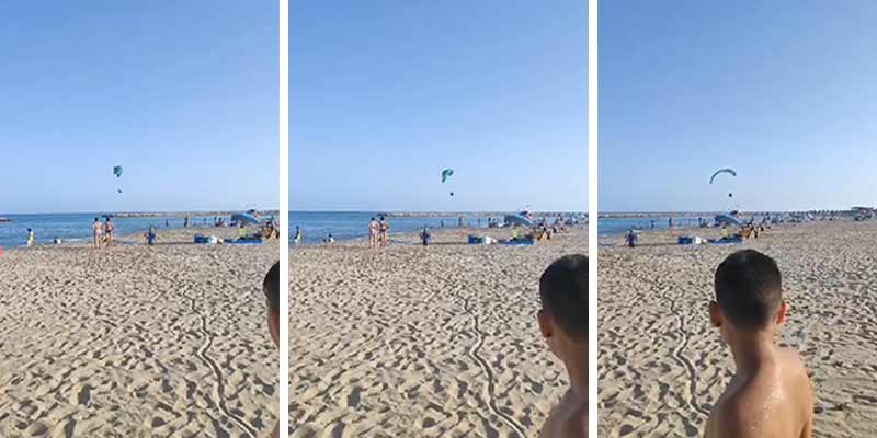 Cae con el paramotor encima de una mujer en la playa "por gilipollas"